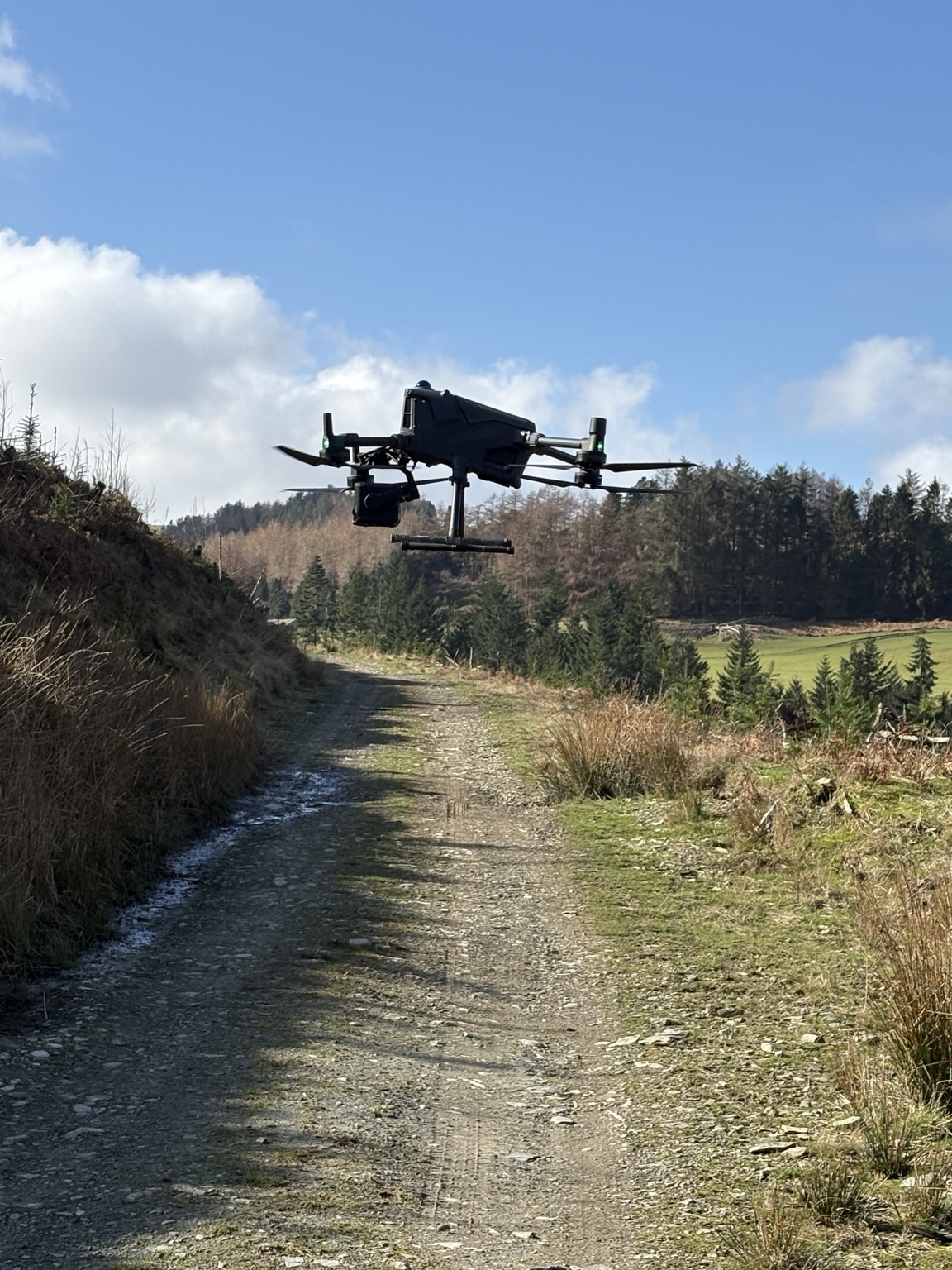 DJI M400 survey aircraft flying at a Welsh forestry site